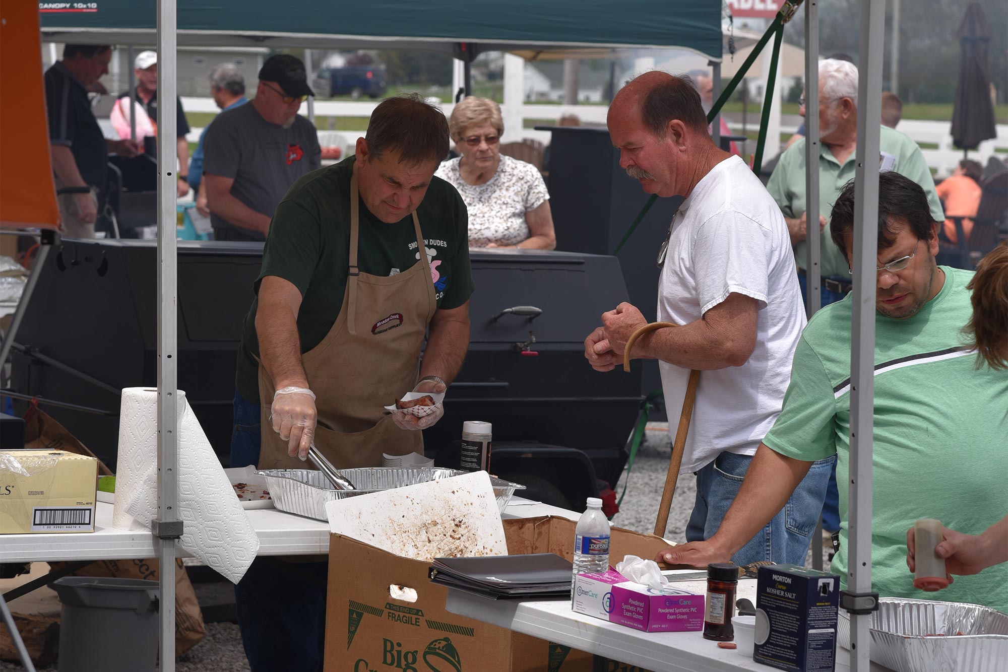 Serving BBQ Samples off the Meadow Creek Pig Roaster Serving BBQ Samples off the Meadow Creek Pig Roaster
