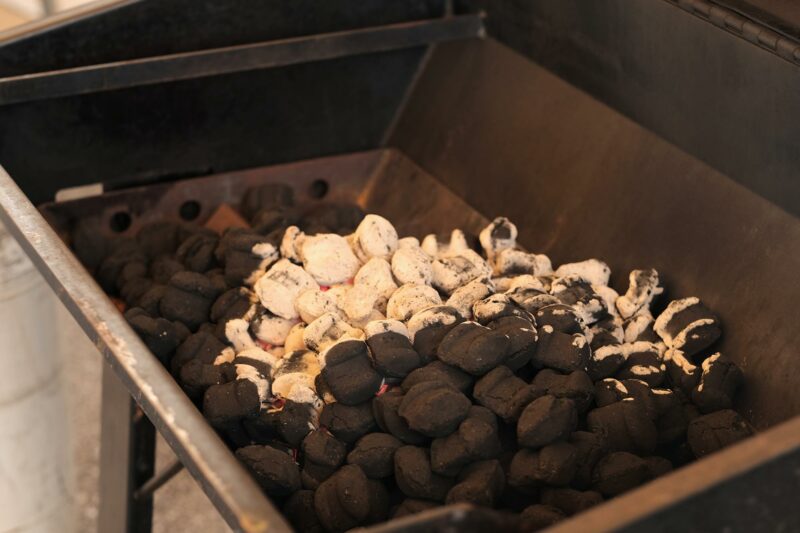 Firing Charcoal on a Meadow Creek Pig Roaster Firing Charcoal on a Meadow Creek Pig Roaster