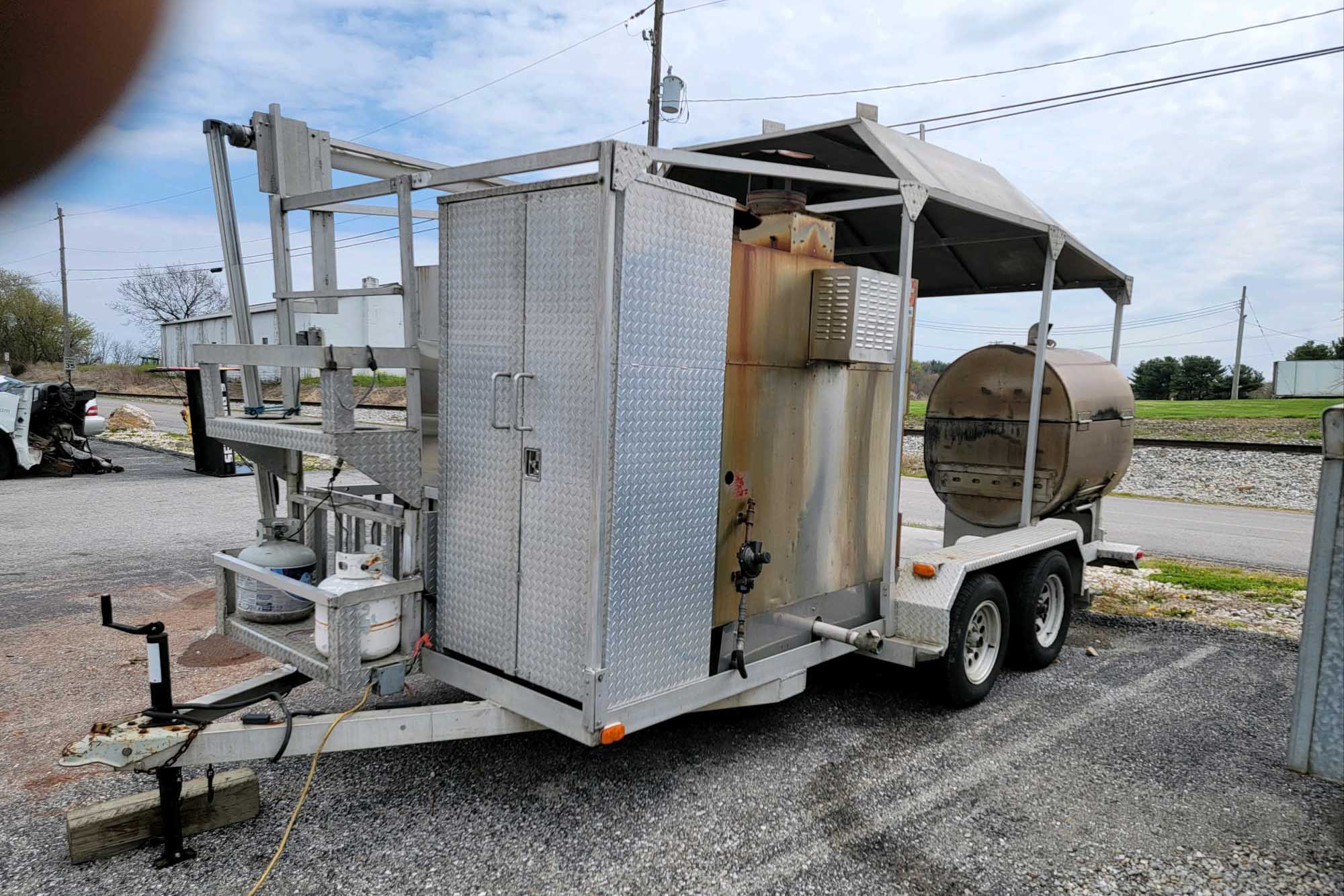 20' Double-Axle Aluminum Trailer With SPK 700 Southern Pride 20' Double-Axle Aluminum Trailer with a Southern pride SPK 700 and a 3' by 4' all stainless steel Smith deal smoker and a glow variable speed automatic slicer