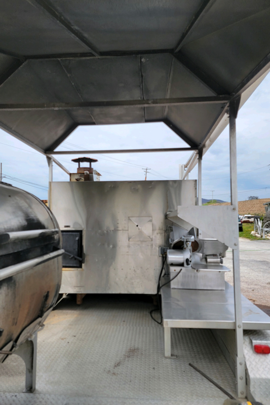 20' Double-Axle Aluminum Trailer With SPK 700 Southern Pride 20' Double-Axle Aluminum Trailer with a Southern pride SPK 700 and a 3' by 4' all stainless steel Smith deal smoker and a glow variable speed automatic slicer