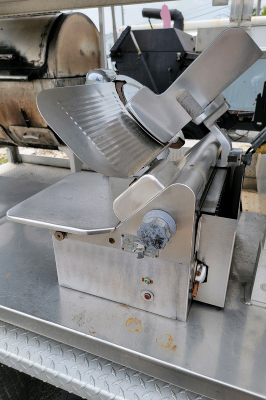 20' Double-Axle Aluminum Trailer With SPK 700 Southern Pride 20' Double-Axle Aluminum Trailer with a Southern pride SPK 700 and a 3' by 4' all stainless steel Smith deal smoker and a glow variable speed automatic slicer