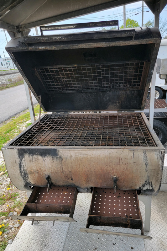 20' Double-Axle Aluminum Trailer with a Southern pride SPK 700 and a 3' by 4' all stainless steel Smith deal smoker and a glow variable speed automatic slicer
