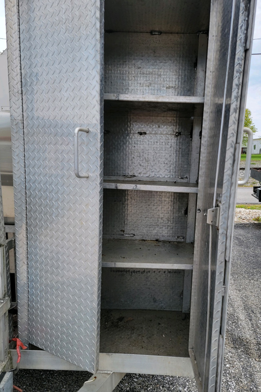 20' Double-Axle Aluminum Trailer with a Southern pride SPK 700 and a 3' by 4' all stainless steel Smith deal smoker and a glow variable speed automatic slicer