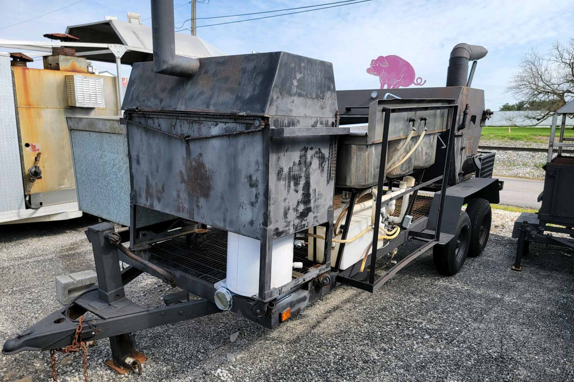 20' Double-Axle Trailer 20' Double-Axle Trailer With 6' x 3' Smoker, a 2' x 3' Smoker, Stainless Steel Table, and 3-Bowl Sink