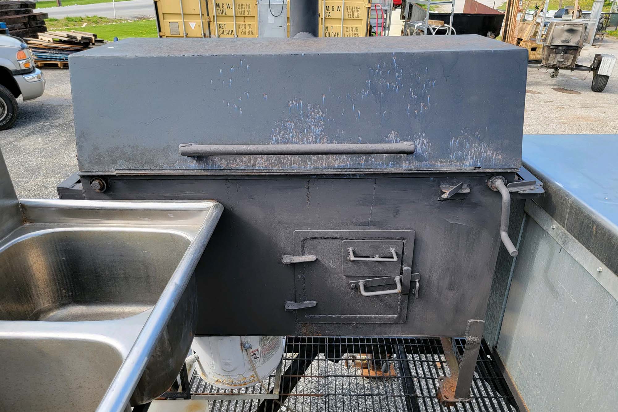 20' Double-Axle Trailer 20' Double-Axle Trailer With 6' x 3' Smoker, a 2' x 3' Smoker, Stainless Steel Table, and 3-Bowl Sink